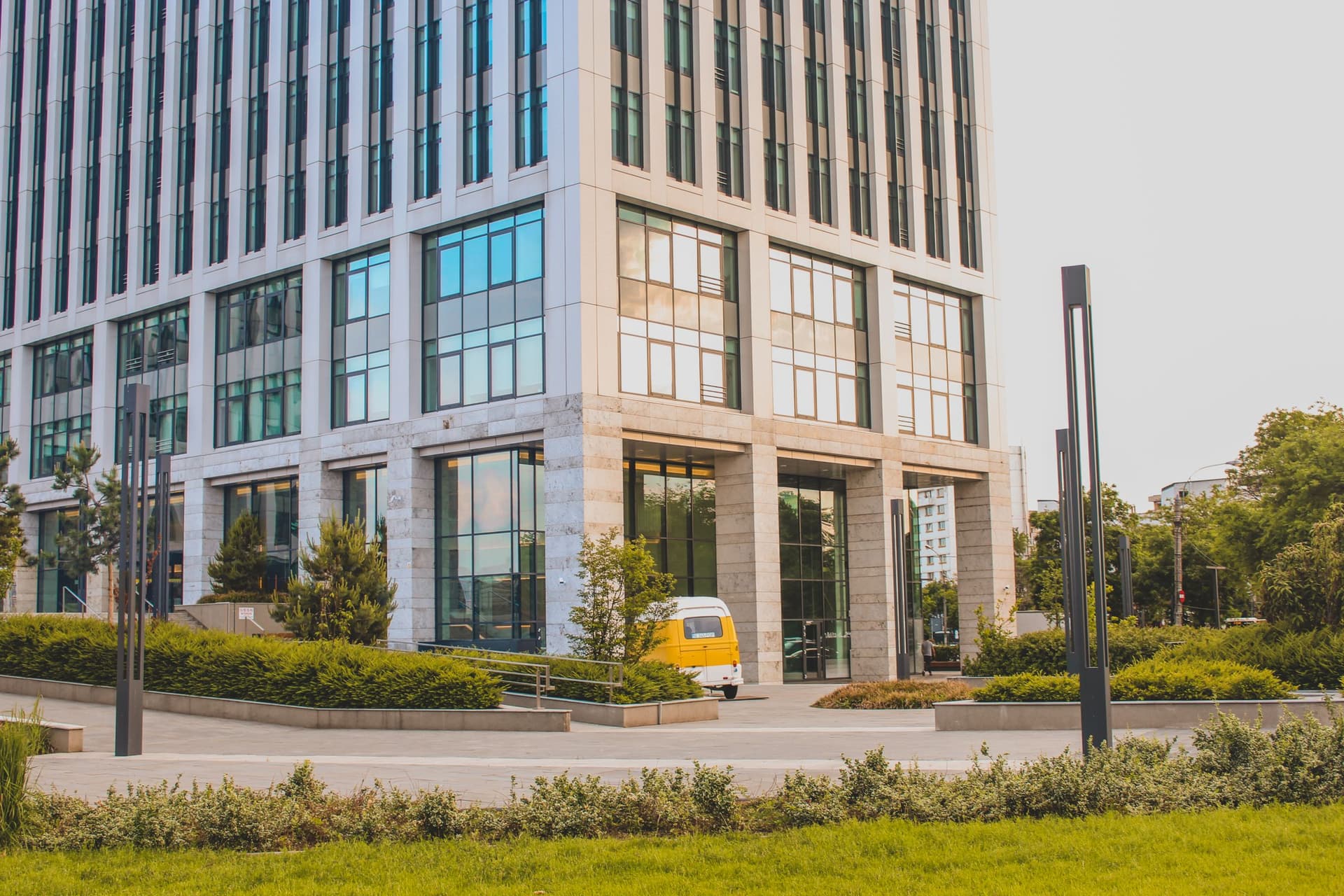 Office building with maintained lawn edges and planting beds